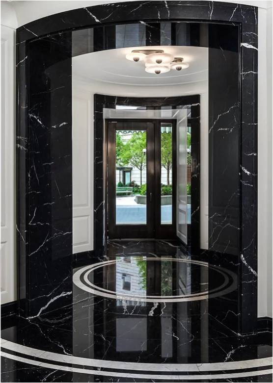 Black marble rotunda entrance with polished floors at Bryant Park Condominiums, NYC
