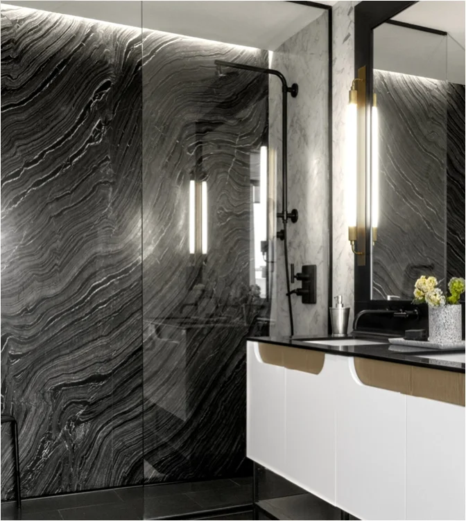 Dramatic black stone bathroom with flowing veins at The Copper Towers, NYC